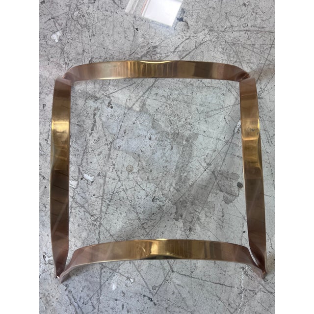 Vintage brass and glass coffee table by Roger Sprunger for Dunbar, featuring heavy octagonal glass top, and curved brass...