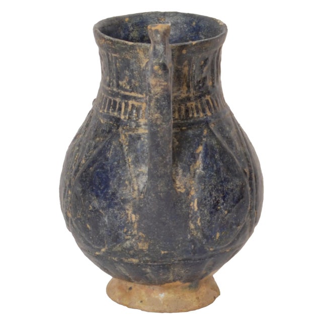 A rare ancient Persian totally intact 12th/13th Century Islamic vessel/jug, from Khorasan. The vessel with a deep blue...