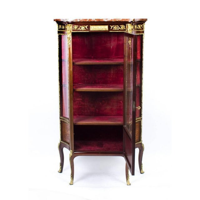 This is a stunning antique french mahogany and ormolu-mounted display cabinet in the french louis xv manner, circa 1870 in...