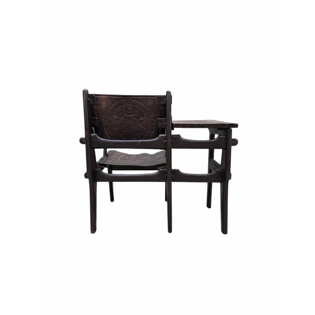 Vintage Tooled Leather Primitive Wood Base Gossip Chair by Angel Pazmino This rare and unique vintage carved walnut and...