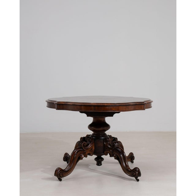 A highly functional Victorian tilt-top table, featuring a hinged surface and a cleverly concealed storage compartment....