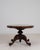 A highly functional Victorian tilt-top table, featuring a hinged surface and a cleverly concealed storage compartment....