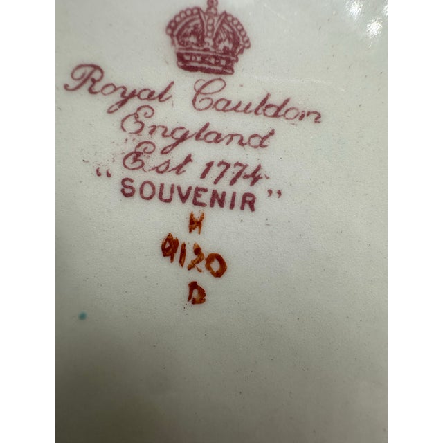 This is a pair of antique English porcelain plates by Royal Cauldon, in the richly detailed “Souvenir” pattern, showcasing...