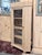 A beautifully crafted corner display cabinet executed in warm natural pine. Designed to maximize space while maintaining...