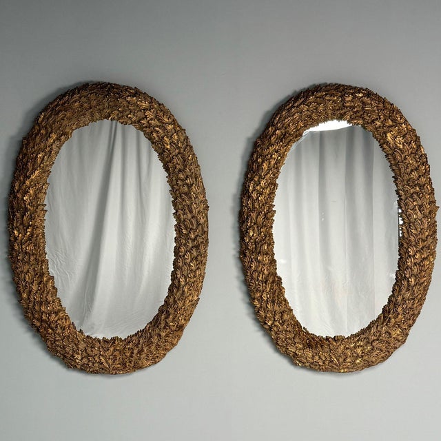 Hollywood Regency, Large Oval Wall, Pier or Console Mirrors, Carved Giltwood, Leaf Motif, 21st C. Pair of large and...