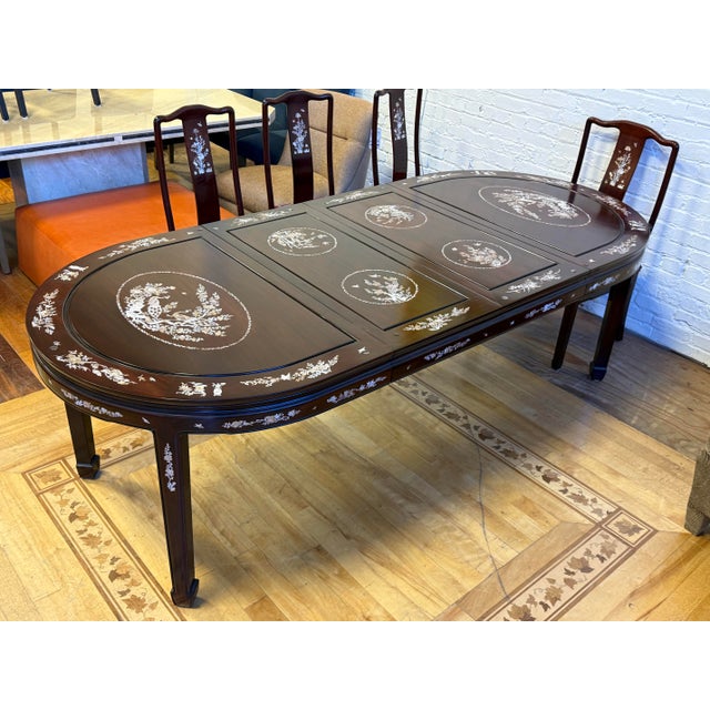 Design Plus Gallery presents a Vintage Qing Dynasty Style Dining Room Set. The set is composed entirely of Rosewood,...