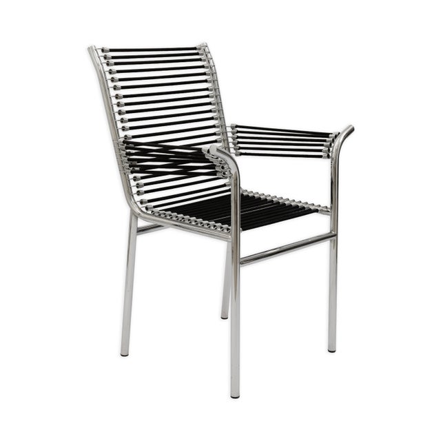 This pair of René Herbst highback chairs exemplifies the designer’s pioneering approach to modernist furniture through the...