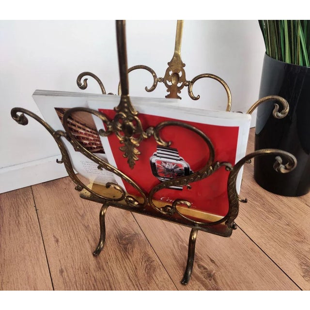 Beautiful and stylish Italian Baroque neoclassical brass magazine stand or rack dated around the 1950s. A great piece that...