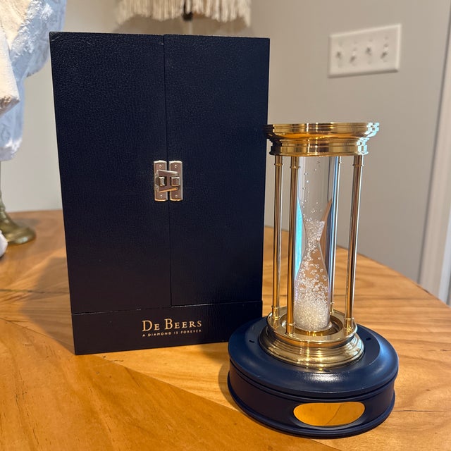 This Limited Edition Millennium 2000 Diamond Brass Hourglass Timer by De Beers features an hourglass filled with over...