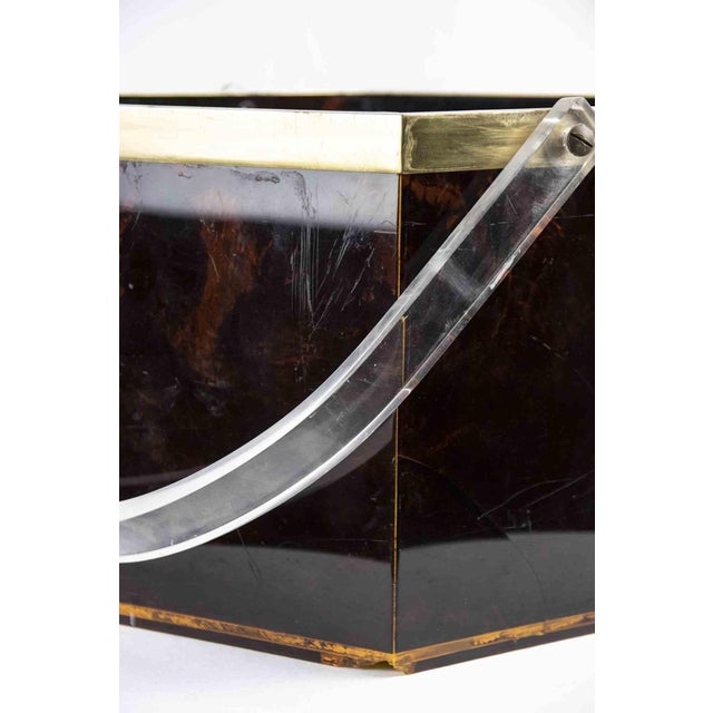 Vintage bottles holder is an original decorative object realized in the 1970s. Original Resin, Transparent acrylic and...