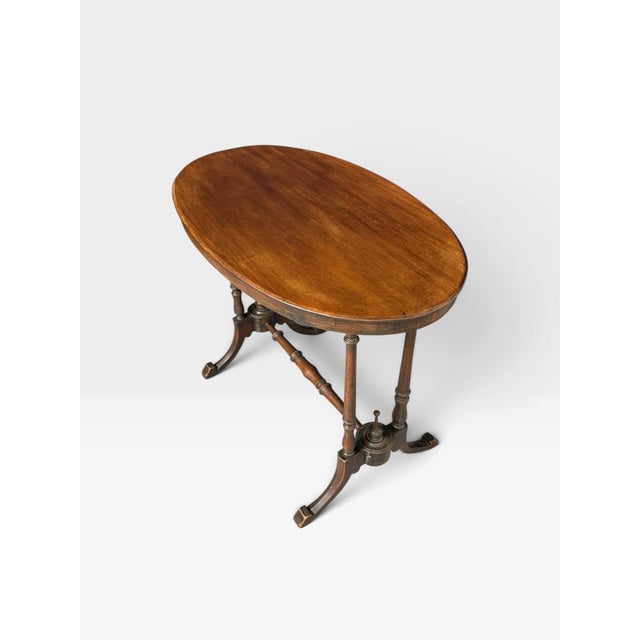 This Victorian oval centre table dates to the mid-to-late 19th century, specifically between 1860 and 1870. The...