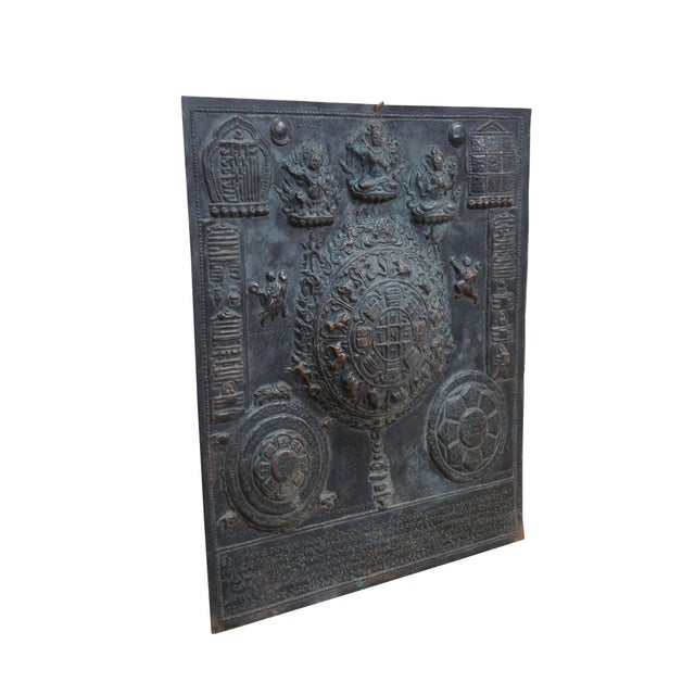 This metal plaque is a Tibetan astrological calendar, often referred to as a Srid-pa-ho or Tibetan Zodiac Mandala. Made...
