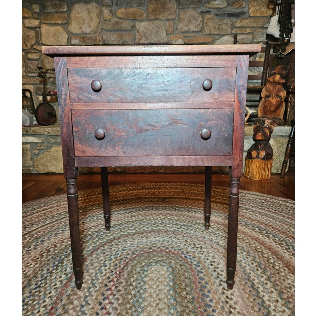 This early 19th-century Federal or Sheraton sewing table blends timeless history with a touch of modern eclectic charm....