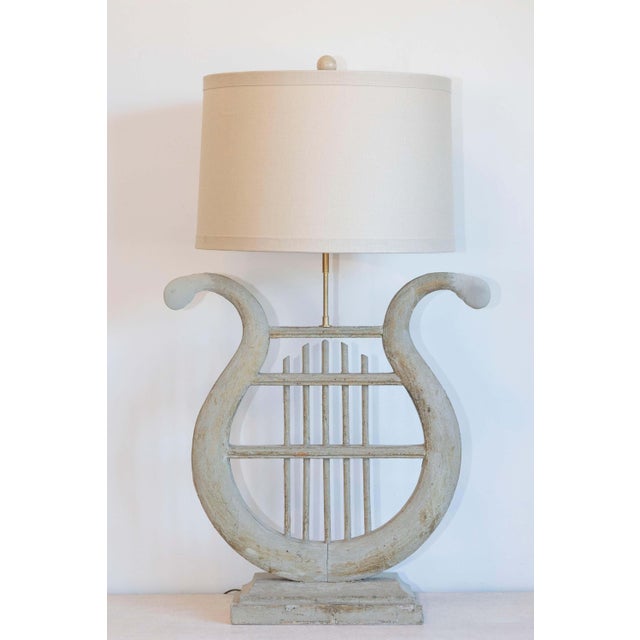 This exquisite 19th-century French lamp is a striking example of timeless craftsmanship and design, inspired by the...