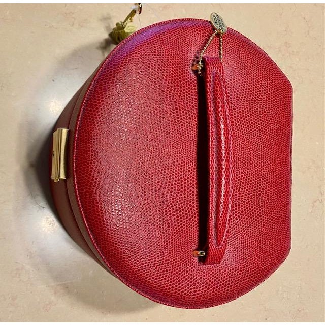A brand-new vintage WOLF leather jewelry box in pebbled red, featuring a gold lock, anti-tarnish lining, interior mirror,...