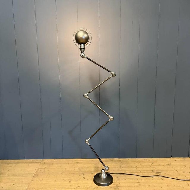 Polished 5-arm Jieldé floor lamp with a blue Jieldé brand plate. Designed by the French engineer Jean-Louis Domecq in the...
