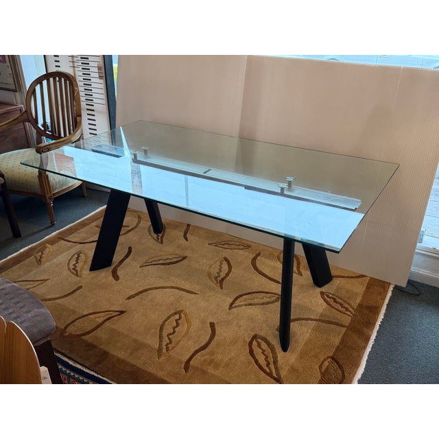 Design Plus Galley presents the Chronos Dining Room Table by Guisi Mastro for Roche Bobois. The table has a tempered glass...