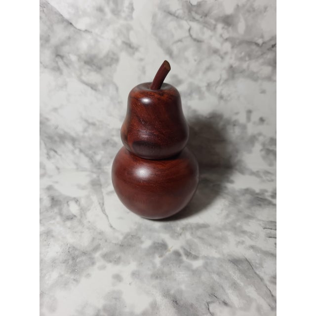 Gorgeous hand carved wood fruit stash box. Beautiful and polished in excellent condition. No makers mark.