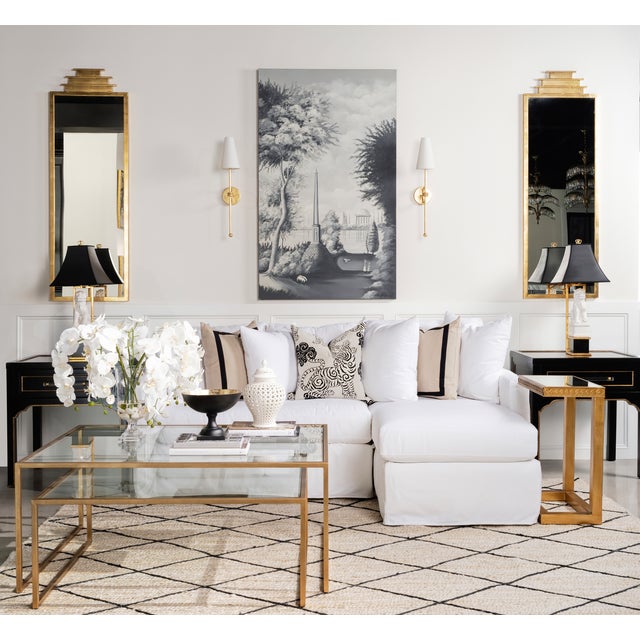 Refined and understated, this tall wall sconce brings a graceful silhouette and subtle shimmer to any interior. Finished...