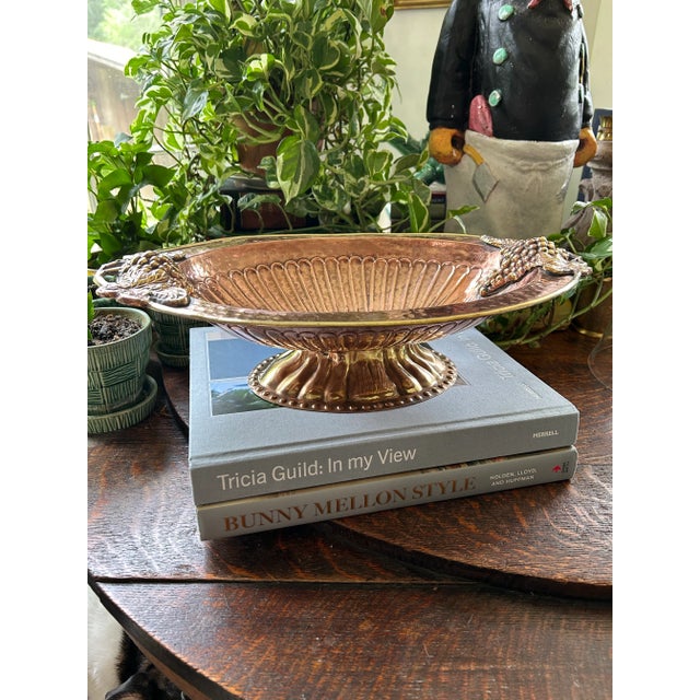 This vintage copper and brass piece has a rustic look and will make a beautiful centerpiece in so many settings. The...