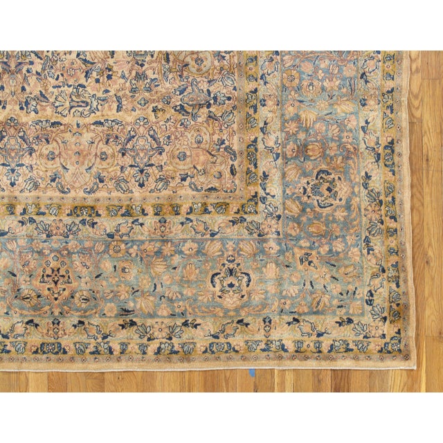 This master crafted Persian Kerman carpet exemplifies the profound understanding of the artistic principles of balance and...