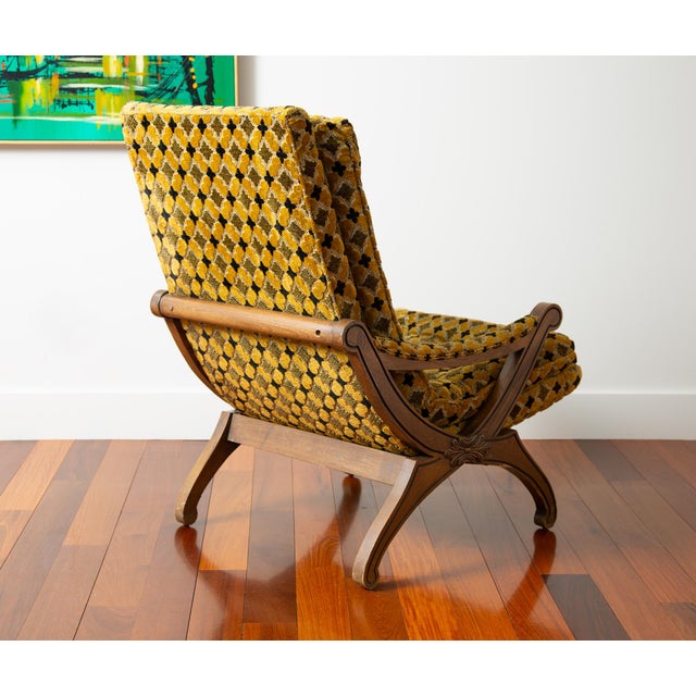 This chair is epic! Featuring a super cool scoop seat, tufted gold and black plush custom upholstery, hardwood X-base...