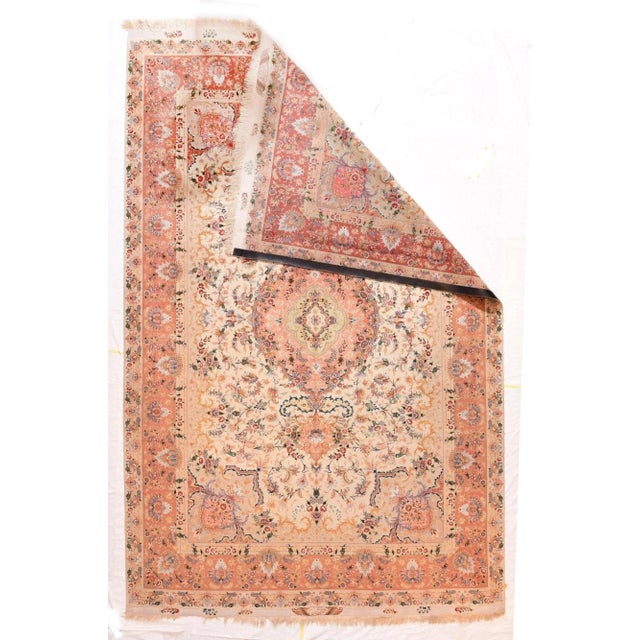 Elaboration knows no bounds on this very finely woven, NW Persian urban carpet with an eggshell sub-field hosting myriads...