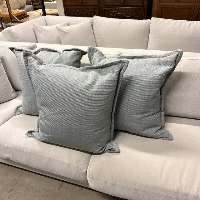 Design Plus Gallery presents a Set of Three Ticking Stripe Throw Pillows. The pillows have a light blue tone with very...