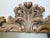 Hand carved Rococo style wood mirror. The wood frame with a light wash of gilding with mostly wood showing through. The...