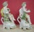 Pair of Derby porcelain cherub figures originally designed as candlesticks but now lacking sconces. Each cherub posed atop...