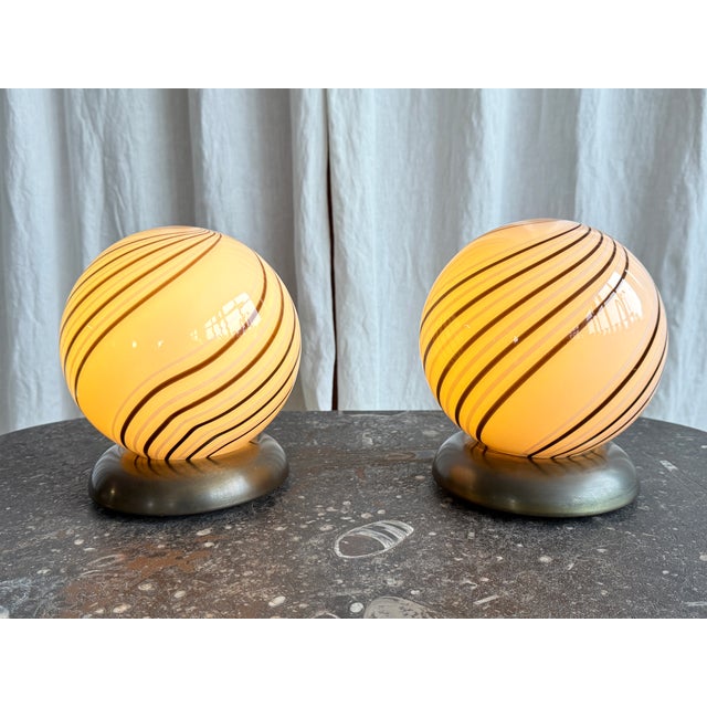 Beautiful mid century globular beige Murano glass lamp with chocolate brown and white swirl pattern, Italy, 1970s. An...