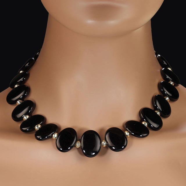 This striking 18‑inch necklace showcases a series of highly polished oval onyx tablets, each measuring 24×18 mm and...