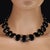 This striking 18‑inch necklace showcases a series of highly polished oval onyx tablets, each measuring 24×18 mm and...