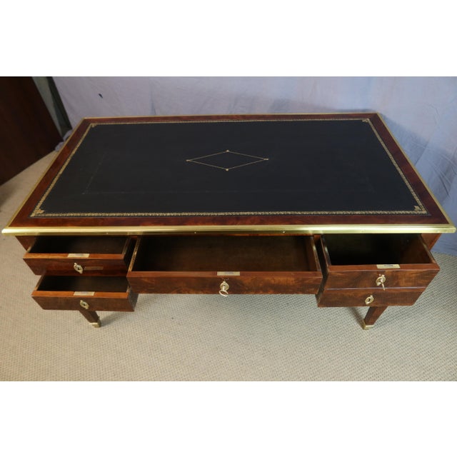 A mahogany desk in the directoire style, dating from the first half of the 19th century. This desk has been fully restored...