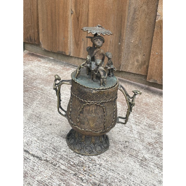 Ornate, cast brass/bronze vessels/pots (Kuduo) were the possessions of kings and courtiers in the Akan kingdoms, from pre...