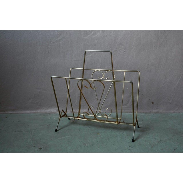 This charming vintage magazine rack will find a perfect spot in the living room, between two cocktail chairs. Made of...