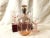Vintage Art Deco pink glass decanter with sterling silver overlay is classified as "Elegant Glass," with striking machine-...