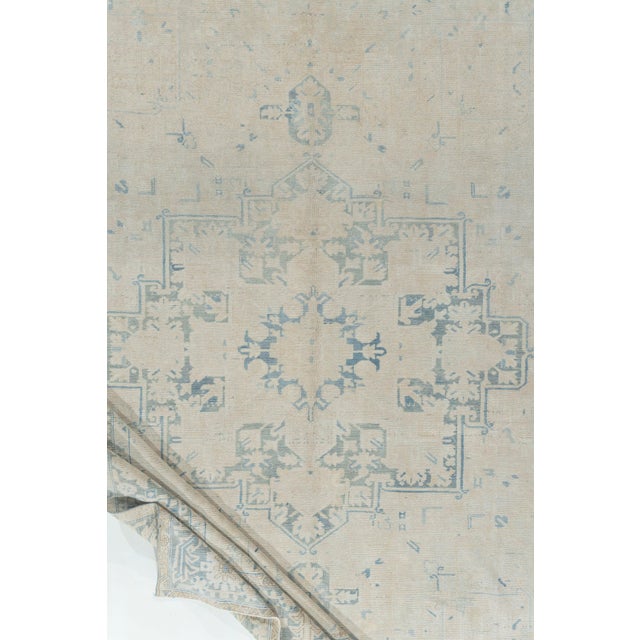 A soft and subdued vintage Heriz rug with character and charm. The soft coloration coupled with the low pile adds the...
