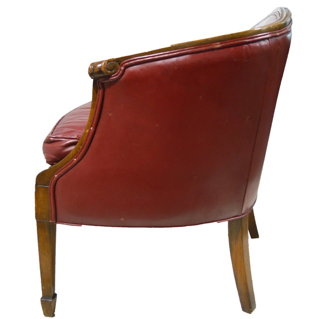 A very hard to find Hepplewhite / Sheraton style sofa form in a rich red leather and figured walnut legs and detail. The...