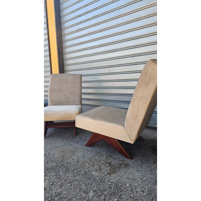 A refined pair of vintage armchairs in the Italian Midcentury Modern style, characterized by a clean, geometric silhouette...
