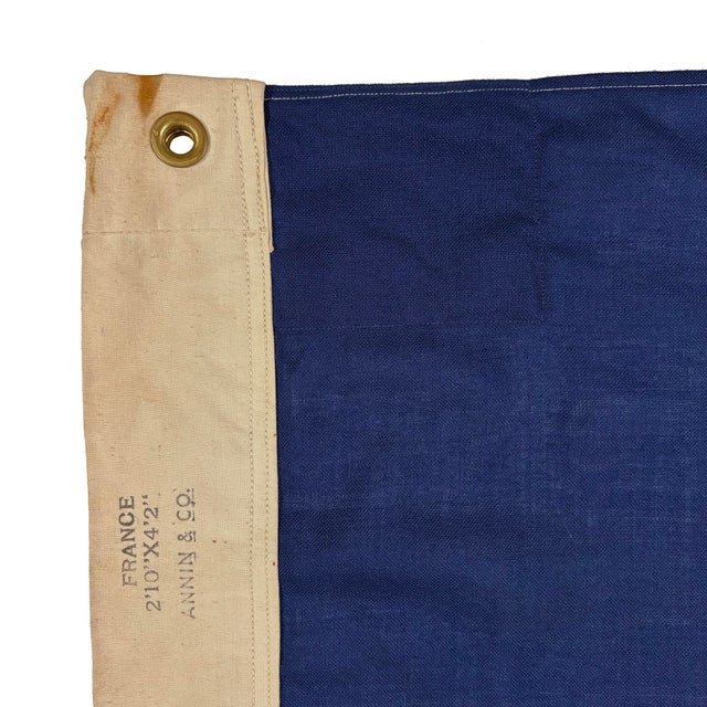 This vintage French flag is fully sewn from a blended wool cloth in muted and yellowed colors. Please note staining and...