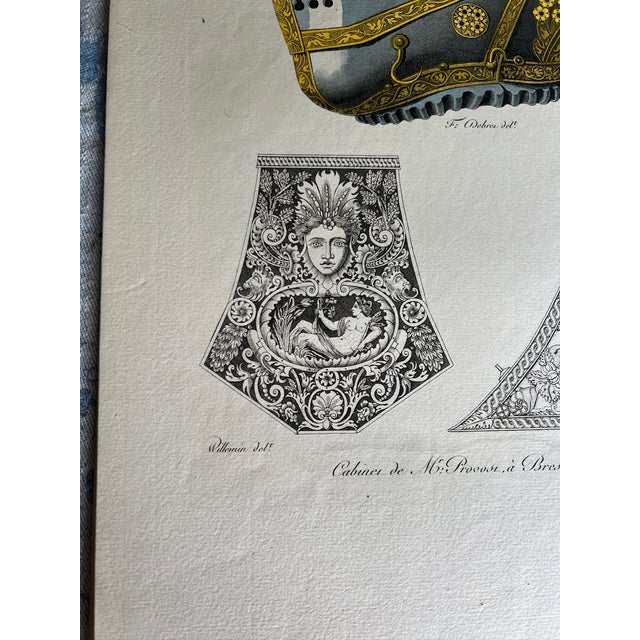 This etching reproduction depicts the armor and powder flasks worn in the 16th century. The title reads "Casque et poires...