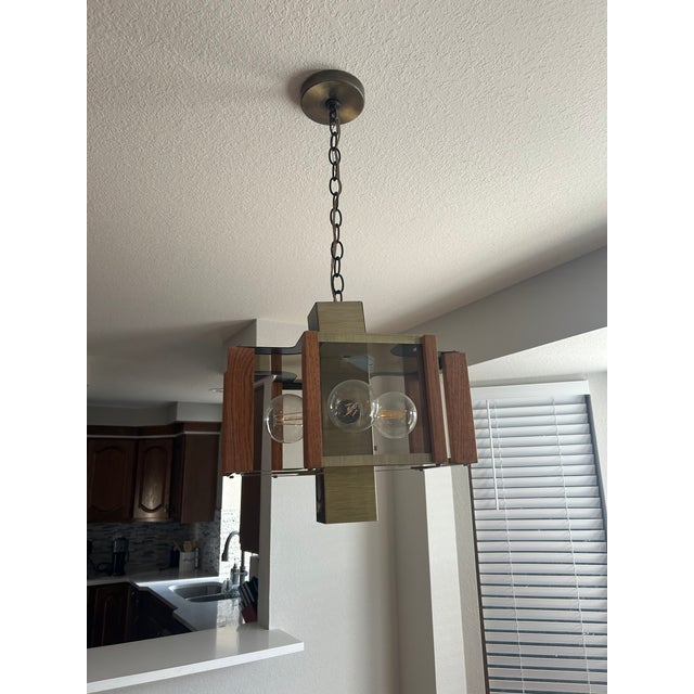 Beautiful Mid century Wood and Brass Chandelier in Perfect working order, no scuffs scratches or broken glass.