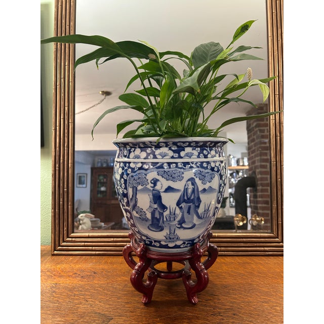 Circa 1900 Chinese Blue & White Prunus Figural Porcelain Jardinière With Wood Stand For Sale - Image 4 of 12