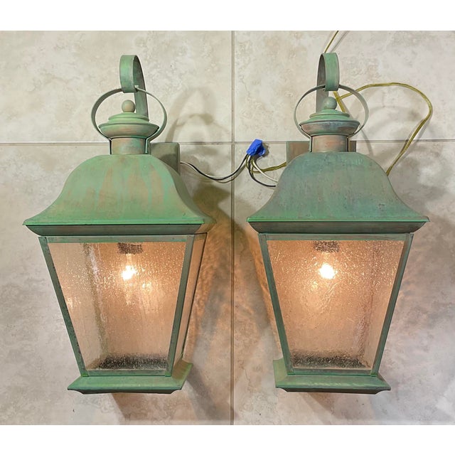 pair of vintage solid brass lanterns exudes timeless elegance and old-world charm. Crafted from , high-quality solid...