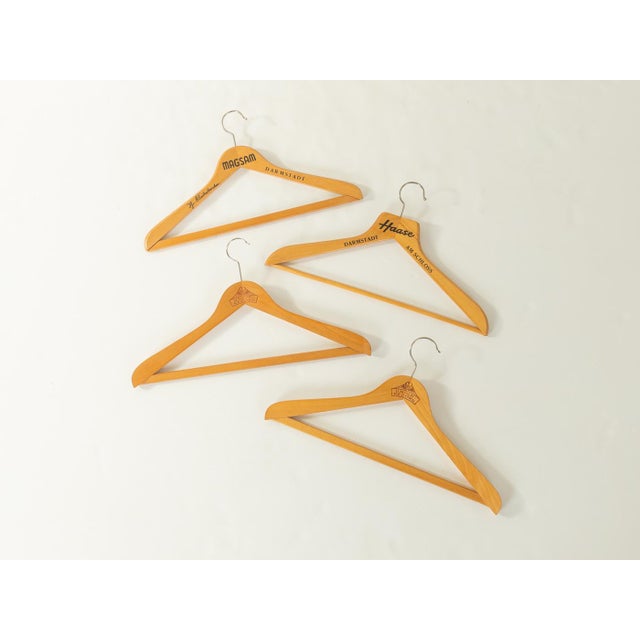 Unique set of four beechwood clothes hangers from Union, Magsam, and Haase, dating from the 1960s. Quality features:...
