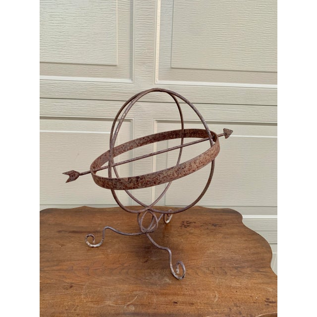 A beautifully crafted iron armillary sphere, evoking the timeless elegance of classical European gardens. Pieces like this...