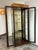 Design Plus Gallery presents a Vintage Campaign Style Curio Display Cabinet. The cabinet is detailed with burl wood...