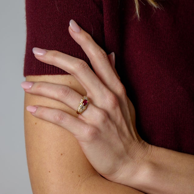 This elegant vintage ruby and diamond ring is a beautiful expression of 1980s design, combining bold color with refined...