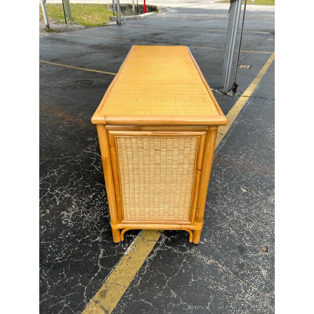 Beautiful bamboo and rattan sideboard/credeza. The front has a sunburst design with bamboo and glass windows in the doors....